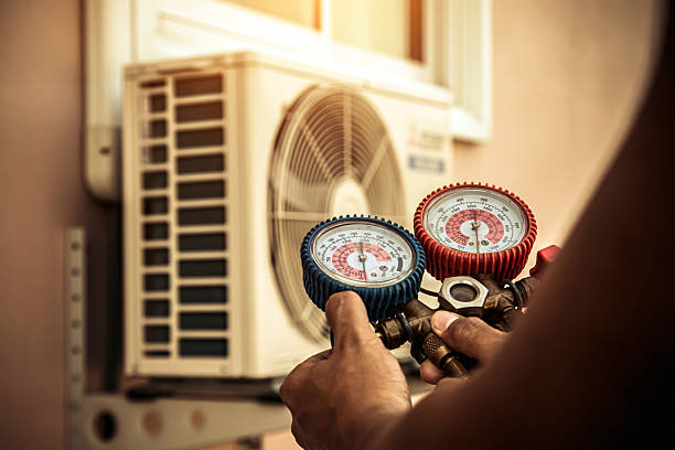 Professional Heat Pump Repair technician working in Needham Heights, MA